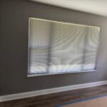 Interior wall painting and window trim finishing with hardwood floors.