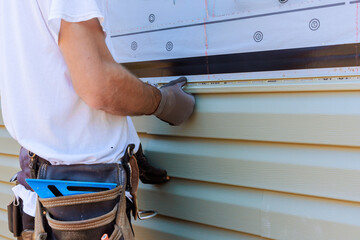 vinyl siding contractors completing residential siding upgrade with precision